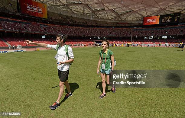 August 2015; Irish athletes Brian Murphy, a member of the 4x400m relay team, and Ciara Everard, women's 800m event, walk around the stadium ahead of...