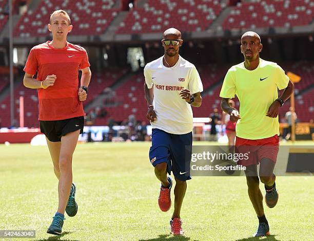 August 2015; Athletes, from left, Galen Rupp of the United States, Mo Farah of Great Britain and Bashir Abdi of Belgium ahead of the IAAF World Track...