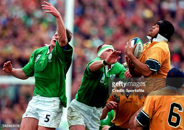 October 1999; Toutai Kefu, Australia, gathers the ball from Trevor Brennan and Malcolm O'Kelly, left, Ireland. 1999 Rugby World Cup, Ireland v...