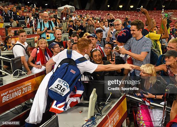 August 2015; Greg Rutherford of Great Britain is greeted by supporters after winning the final of the Men's Long Jump event. IAAF World Athletics...