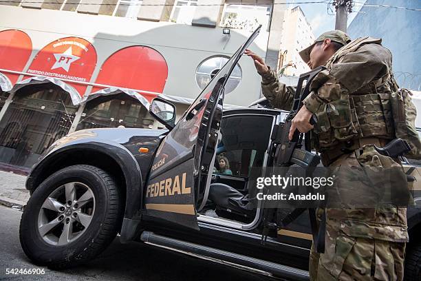 Brazilian Federal Police with search and seizure warrant, surround the national headquarters of the Worker's Party for the collection of evidence...