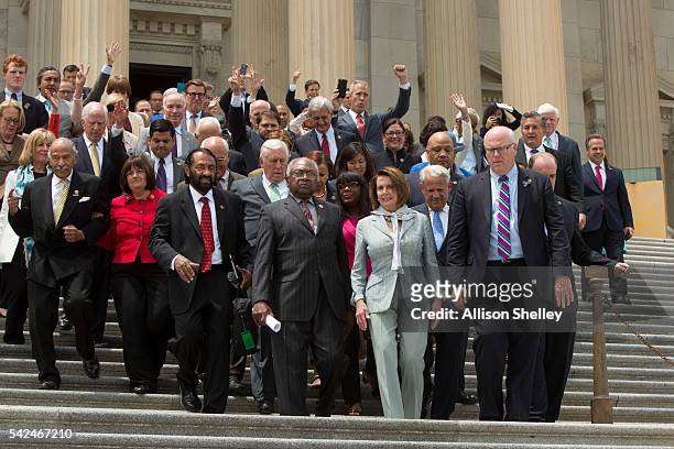 House members led by Minority Leader Nancy Pelosi and James Clyburn , walk down the East Front of the U.S. Capitol building to speak with supporters...
