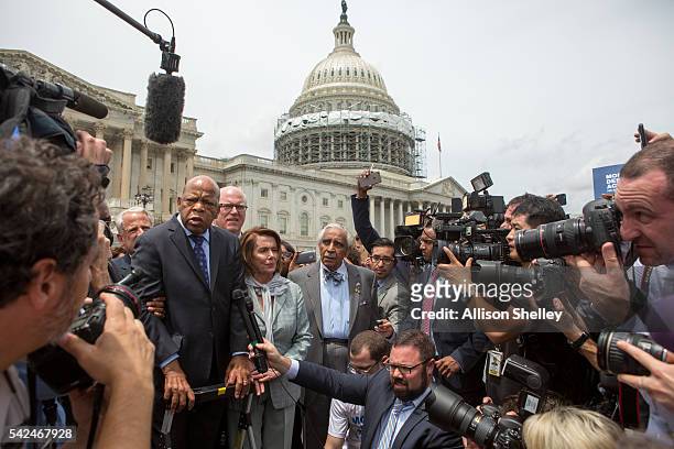 Rep. John Lewis , left, Minority Leader Nancy Pelosi , center, and Charles Rangel, , right, speak with supporters outside the U.S. Capitol building...