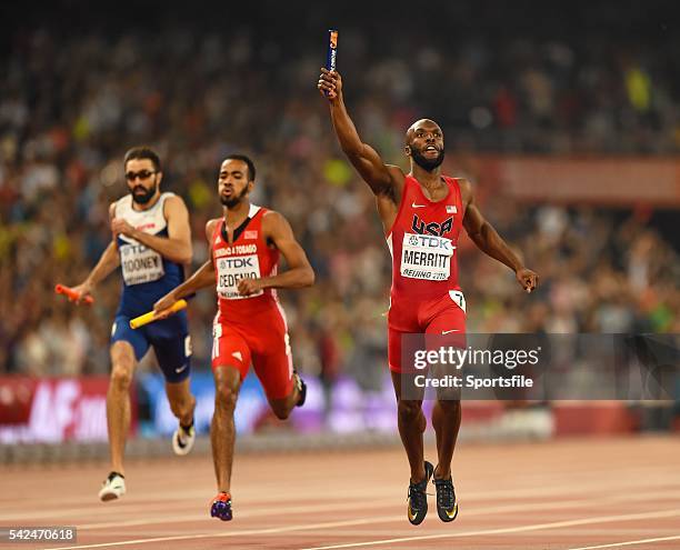 August 2015; Lashawn Merritt of the United States crosses the line to win the Men's 4x400 Relay final ahead of Martyn Rooney of Great Britain, Machel...