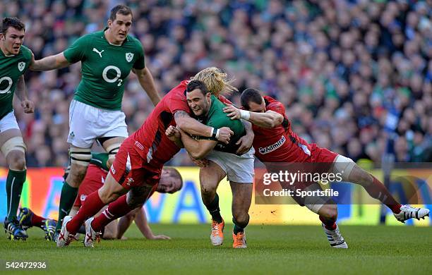 February 2014; Dave Kearney, Ireland, is tackled by Richard Hibbard, left, and Sam Warburton, Wales. RBS Six Nations Rugby Championship, Ireland v...