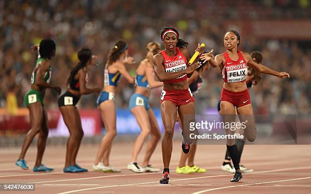August 2015; Francena McCorory receieves the baton from her USA team-mate Allyson Felix during the Women's 4x400m Relay final. IAAF World Athletics...