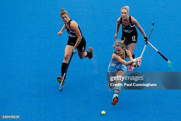 Captain Carla Rebecchi of Argentina under pressure from Brooke Neal and Sophie Cocks of New Zealand during the FIH Women's Hero Hockey Champions...