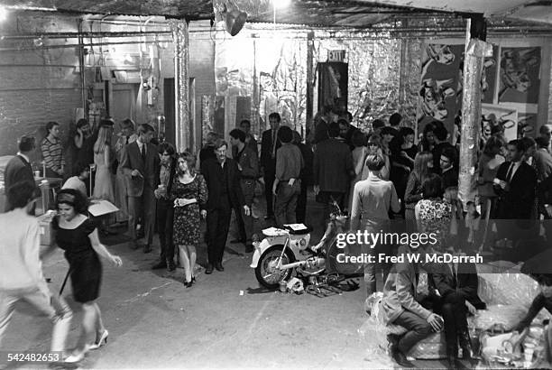 View of the attendees at a party in pop artist Andy Warhol's studio, the Factory , New York, New York, August 31, 1965. Among those pictured are...