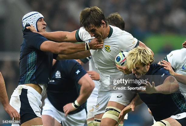 October 2015; Lood de Jager, South Africa, is tackled by Blair Cowan, left, and Richie Gray, Scotland . 2015 Rugby World Cup, Pool B, South Africa v...