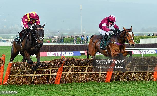 March 2014; Don Poli, right, with Michael Fogarty up, jumps the last ahead of Thomas Crapper, with Joseph Palmowski up, on their way to winning the...