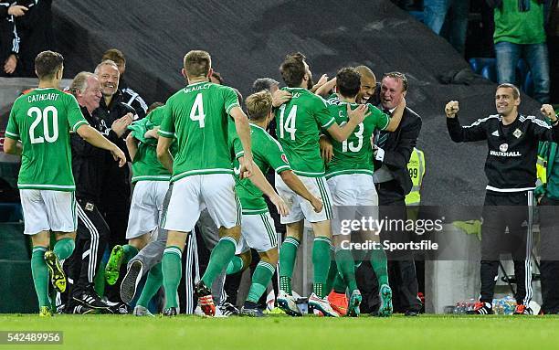 October 2015; Josh Magennis, Northern Ireland, right, hugs Northern Ireland manager Michael O'Neill after scoring his side's second goal. UEFA EURO...