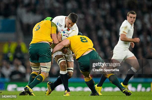 October 2015; Nick Easter, England, is tackled by Scott Fardy, left, and David Pocock, Australia. 2015 Rugby World Cup, Pool A, England v Australia,...