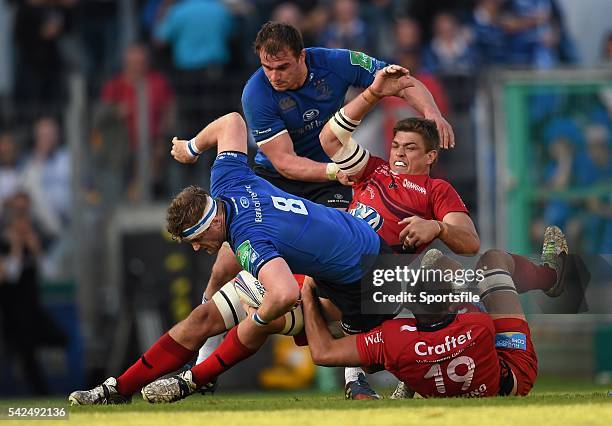 April 2014; Jamie Heaslip with support from his Leinster team-mate Rhys Ruddock is tackled by Juan Smith and Virgile Bruni Toulon. Heineken Cup,...