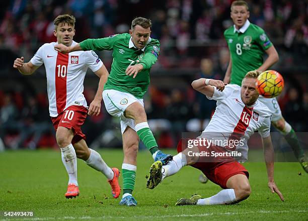 October 2015; Aiden McGeady, Republic of Ireland, takes a shot on goal under pressure from Karol Linetty and Kamil Glik, Poland. UEFA EURO 2016...