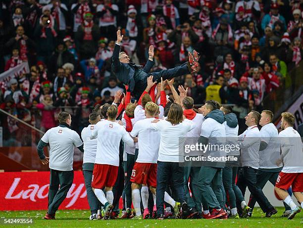 October 2015; Poland players celebrate their team's victory by throwing their manager, Adam Nawalka, in the air. UEFA EURO 2016 Championship...