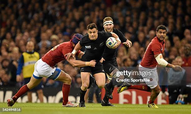 October 2015; Dan Carter, New Zealand, is tackled by Alexandre Dumoulin, France. 2015 Rugby World Cup, Quarter-Final, New Zealand v France....