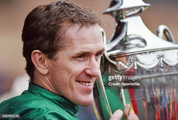 May 2014; Jockey Tony McCoy lifts the trophy after he rode Jezki to win the Racing Post Champion Hurdle. Punchestown Racecourse, Punchestown, Co....