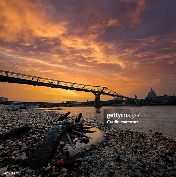 united kingdom, england, london, millenium bridge silhouetted against sunset sky - mattscutt stock pictures, royalty-free photos & images