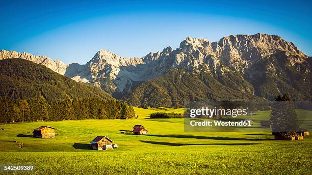 germany, bavaria, krun, barn in meadow, karwendel mountains in background - karwendel stock-fotos und bilder