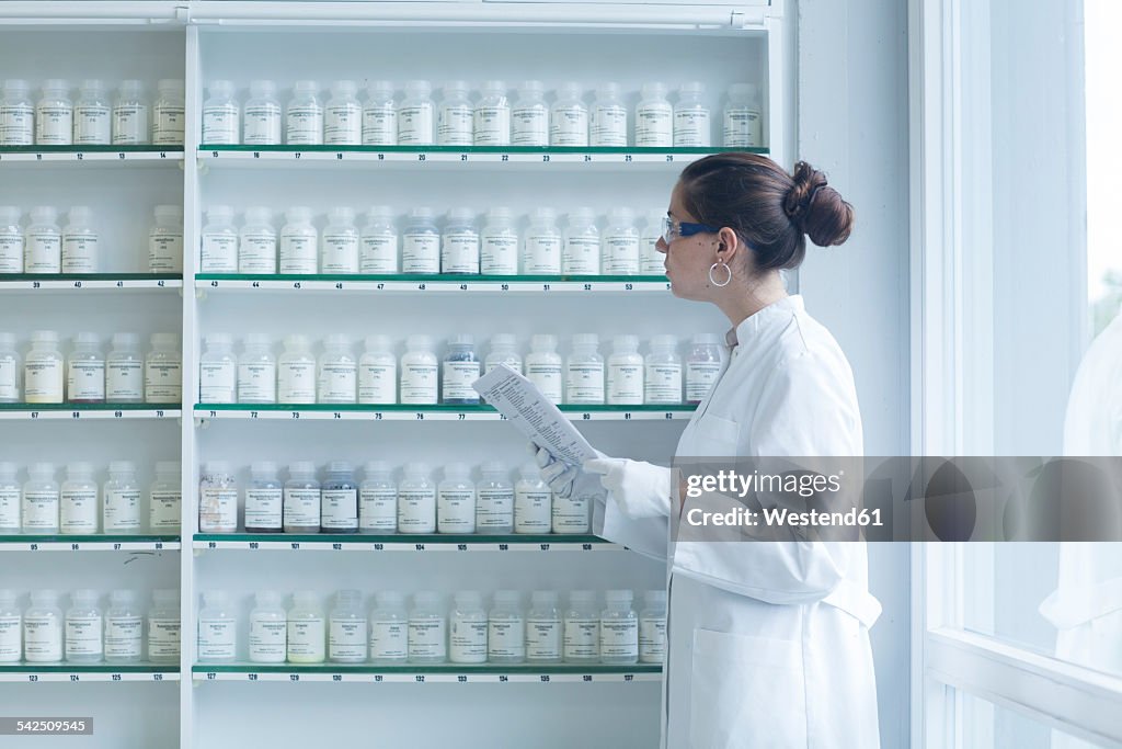 Young female scientist working in a chemical lab