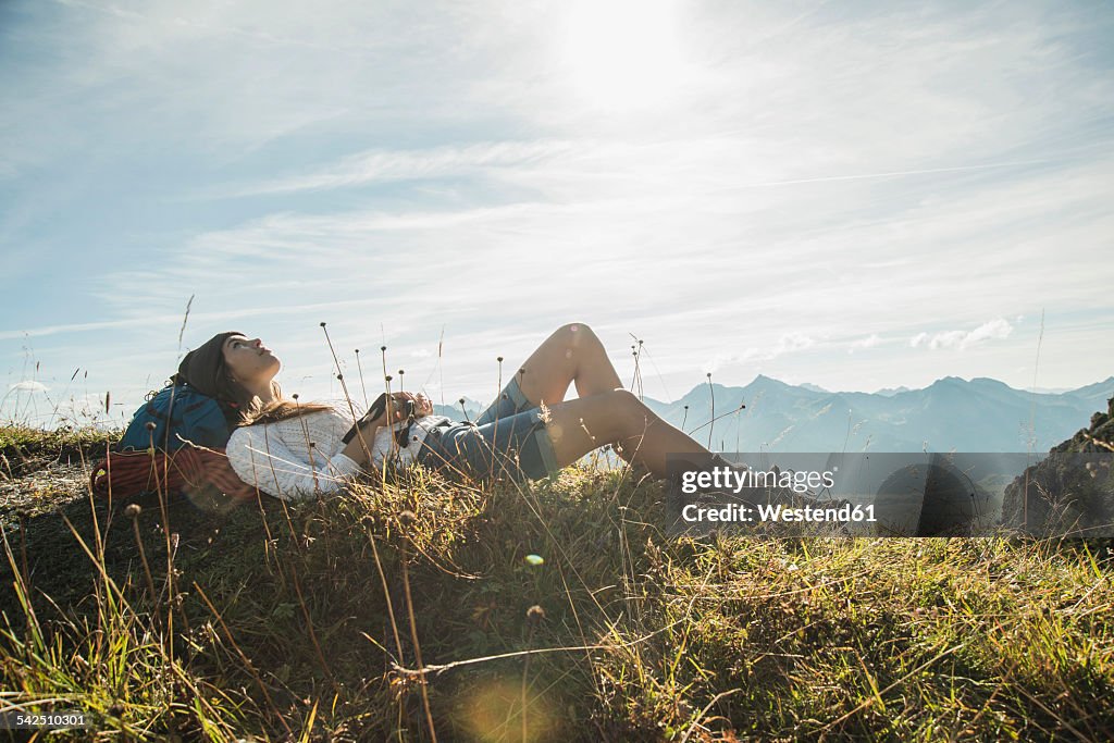 Austria, Tyrol, Tannheimer Tal, young hiker having a rest