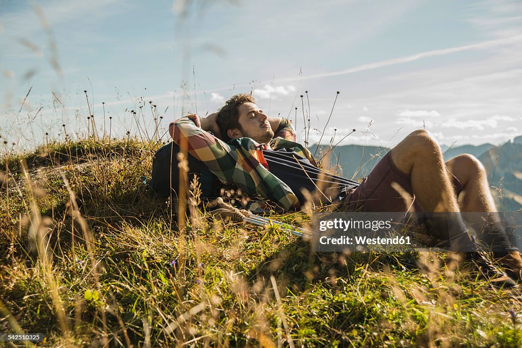 Austria, Tyrol, Tannheimer Tal, young hiker having a rest