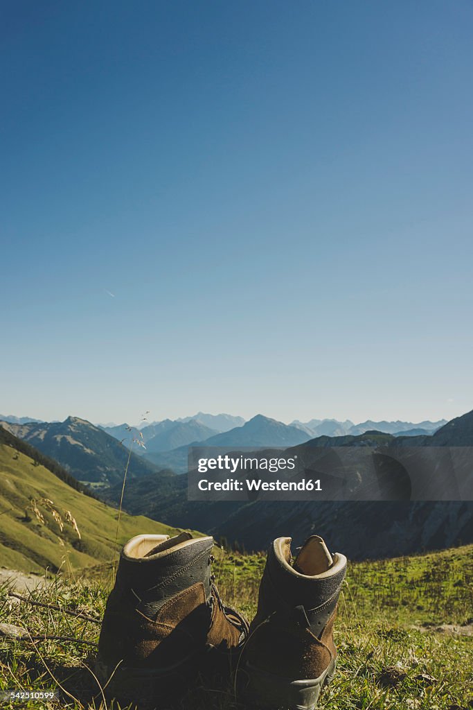 Austria, Tyrol, Tannheimer Tal, hiking boots in mountainscape