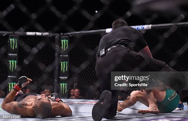 December 2015; Referee John McCarthy pulls Conor McGregor off Jose Aldo to finish their featherweight title bout. UFC 194: Jose Aldo v Conor...