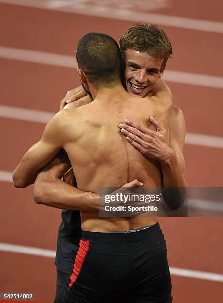 August 2014; Kariem Hussein of Switzerland is congratulated by Felix Franz of Germany, right, after winning the final of the men's 400m hurdles...