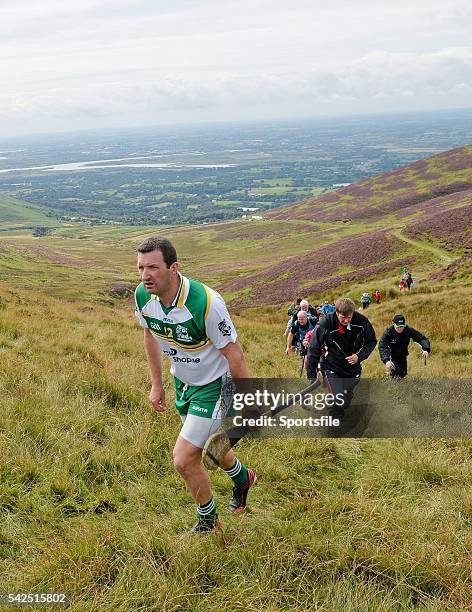 August 2014; Brendan Cummins, Tipperary, makes his way up the mountain to take his next shot during the M. Donnelly All-Ireland Poc Fada Final....