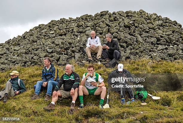 August 2014; Andrew Fahey, Clare, stops for a lunch break before the descent down the mountain. M. Donnelly All-Ireland Poc Fada Final. Annaverna...