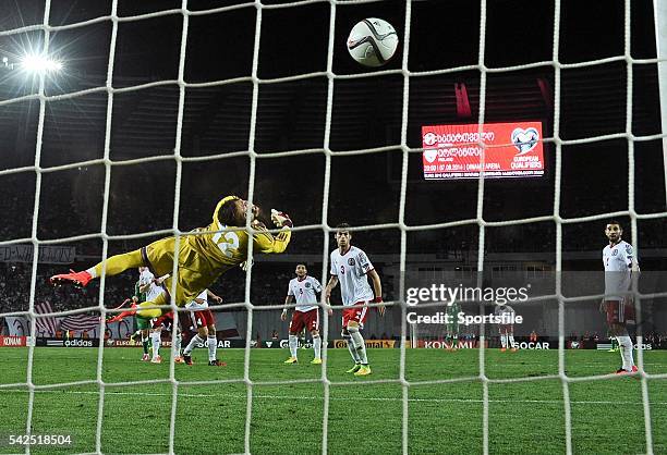 September 2014; Georgian goalkeeper Roin Kvaskhvadze is unable to keep out the shot from Republic of Ireland's Aiden McGeady, left, to win the game....