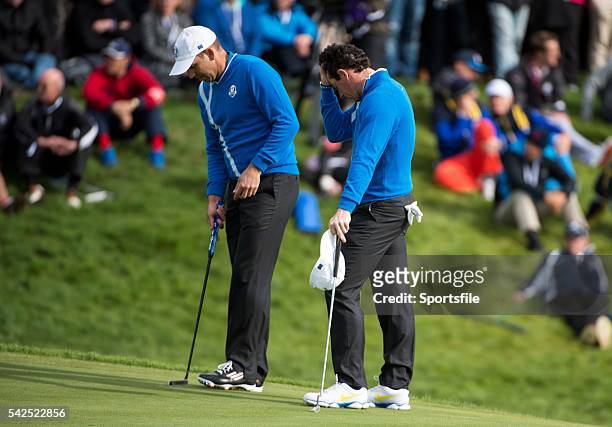 September 2014; Rory McIlroy and Sergio Garcia, Team Europe, on the 18th green after losing the match to Phil Mickelson and Keegan Bradley, during...