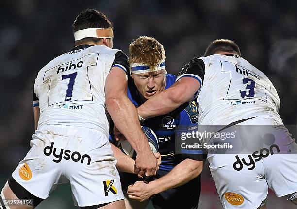 January 2016; James Tracy, Leinster, is tackled by Francois Louw, left, and David Wilson, Bath. European Rugby Champions Cup, Pool 5, Round 5,...