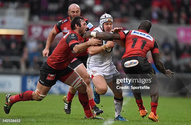 January 2016; Luke Marshall, Ulster, is tackled by Pedrie Wannenburg, left, and Dug Codjo, Oyonnax. European Rugby Champions Cup, Pool 1, Round 6,...