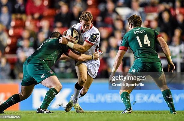 October 2014; Craig Gilroy, Ulster, is tackled by Fraser Balmain, Leicester Tigers, as Blaine Scully looks on. European Rugby Champions Cup 2014/15,...