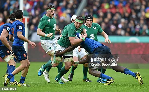 February 2016; CJ Stander, Ireland, is tackled by Yacouba Camara, France. RBS Six Nations Rugby Championship, France v Ireland. Stade de France,...
