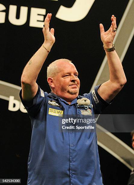 Febraury 2016; Robert Thornton claps the crowd ahead of his match against Raymond Van Barneveld during the Betway Premier League Darts. 3 Arena,...