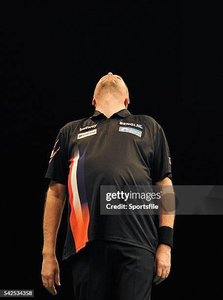 Febraury 2016; Raymond Van Barneveld reacts to missing a chance to win a leg against Robert Thornton during the Betway Premier League Darts. 3 Arena,...