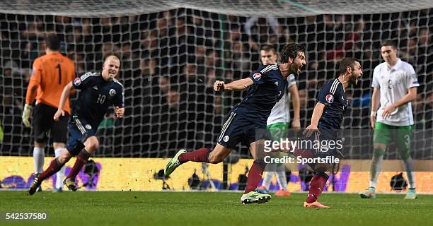 November 2014; Scotland's Shaun Maloney, right, celebrates after scoring his side's first goal with team-mates as Republic of Ireland players look...