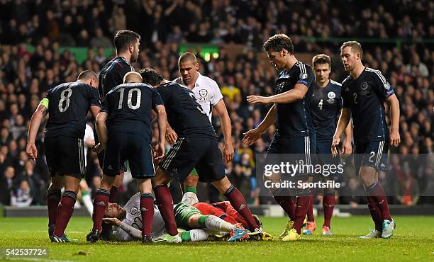 November 2014; Scotland players confront Richard Keogh, Republic of Ireland. UEFA EURO 2016 Championship Qualifier, Group D, Scotland v Republic of...