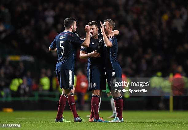 November 2014; Scotland players, from left, Grant Hanley, Russell Martin and Steven Whittaker celebrate their side's victory. UEFA EURO 2016...