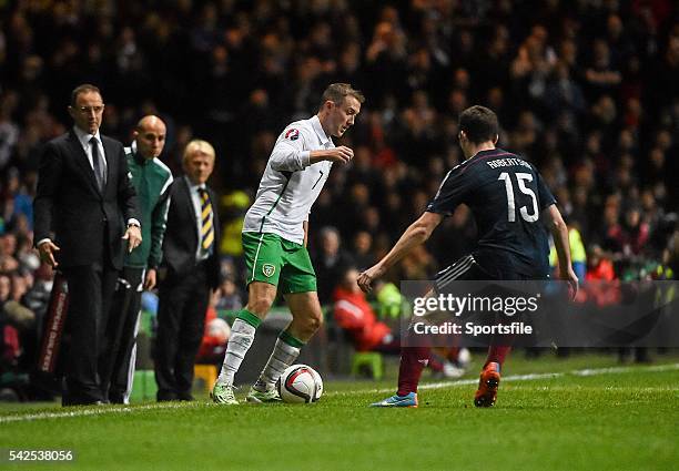 November 2014; Aidan McGeady, Republic of Ireland, in action against Andrew Robertson, Scotland, watched on by Republic of Ireland manager Martin...