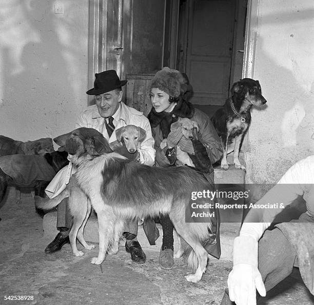 Italian actor Totò in the Ospizio dei Trovatelli, the kennel that Totò had built at his own expense near Rome, housing 220 dogs. Rome, 1956