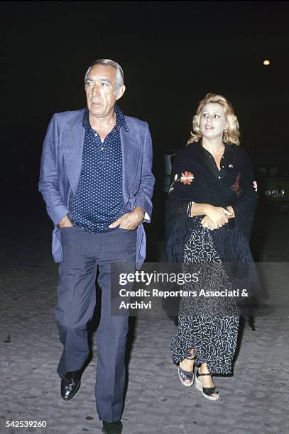 Mexican-born American actor Anthony Quinn walking with his wife Jolanda Addolori. 1978