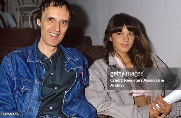 Italian director Dario Argento smiling with his daughter Asia. 1989