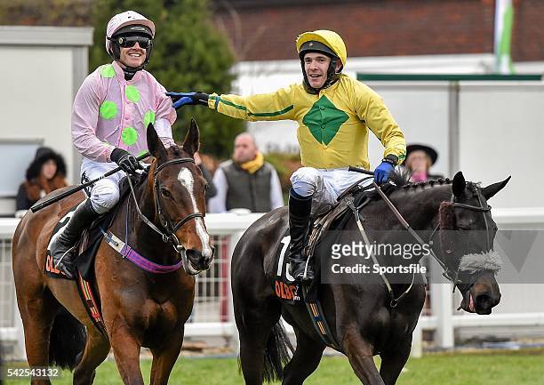 March 2016; Ruby Walsh is congratulated by Tom Scudamore, on Pass The Time, after winning the OLBG Mares' Hurdle on Vroum Vroum Mag. Prestbury Park,...
