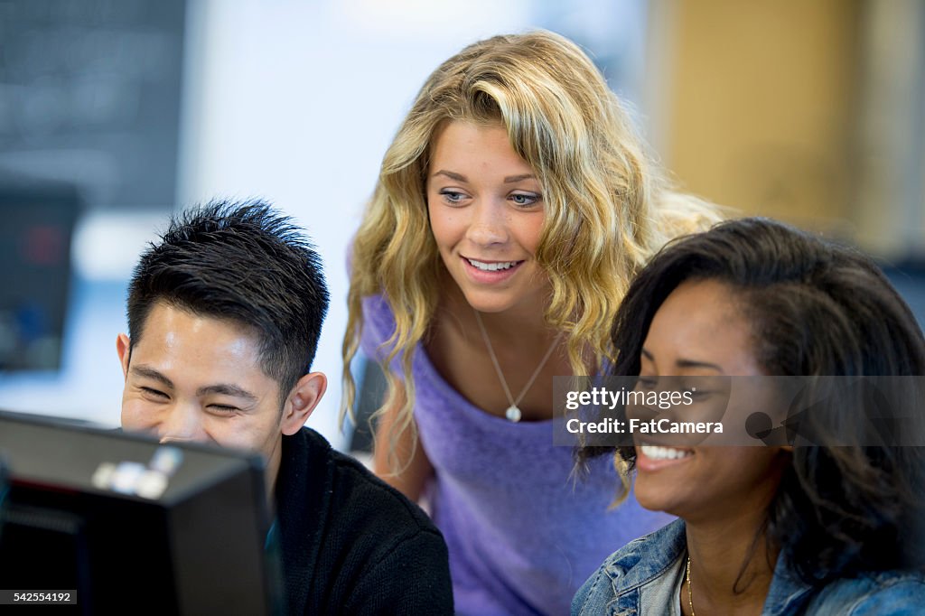 Computer Friends Example Friends Working On A Computer Together High-Res Stock Photo - Getty Images