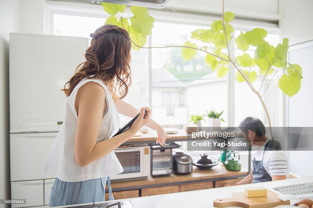 Japanese young couple cooking on holiday