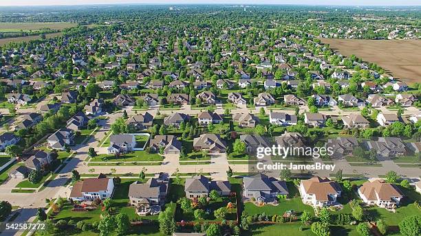 aerial view of upper class neighborhood on sunny morning. - wisconsin house stock pictures, royalty-free photos & images